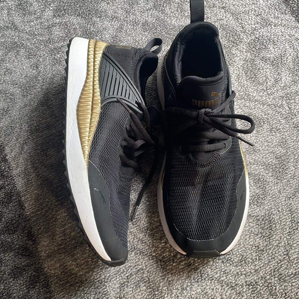 Puma pacer next cage gold and black sneakers